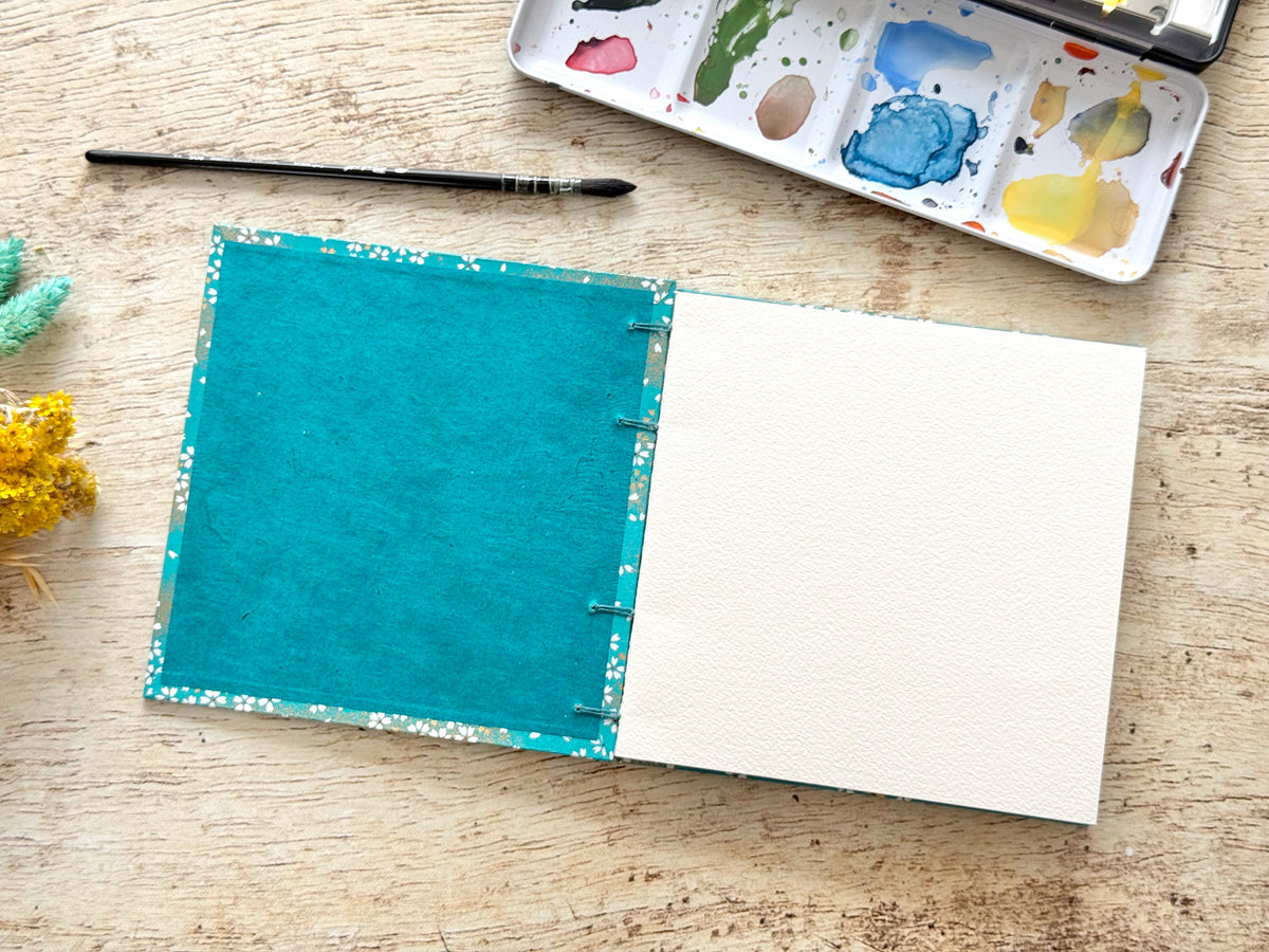Carnet d’aquarelle carré 15 × 15 cm - Papier Arches - Fleurs au vent bleu canard